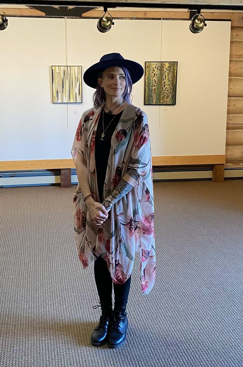 Kimberly at a gallery showing with her paintings
